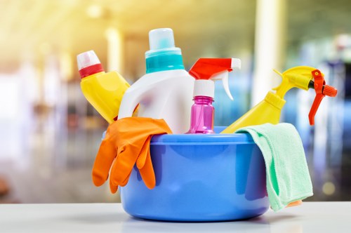Cleaner wearing PPE during a carpet cleaning task